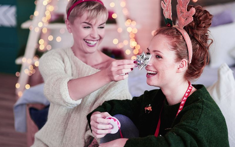 two women having fun during Christmas