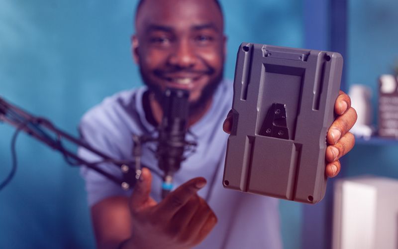 Man holding up YouTube sponsored product